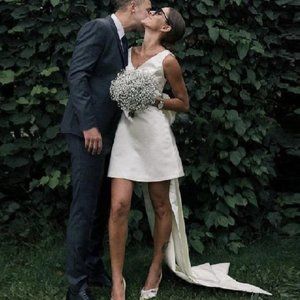 Stunning Short Satin V-Neck Bridal Gown with Large Bow and Open Back